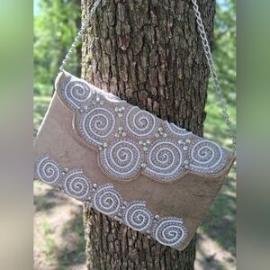Elegant Beige Clutch with Silver Accents